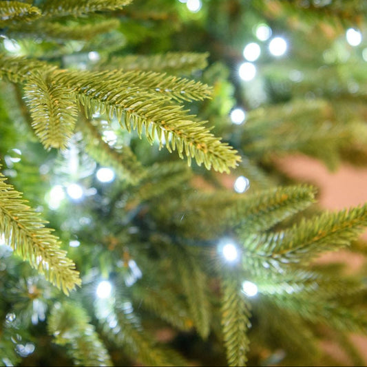 LED 12' Fraser Fir Tree, White - needles and white lights close-up