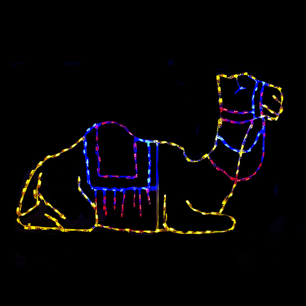 Laying Camel LED nativity display, resting camel with saddle silhouette in multicolor mini lights — yellow, blue and pink — on steel frame