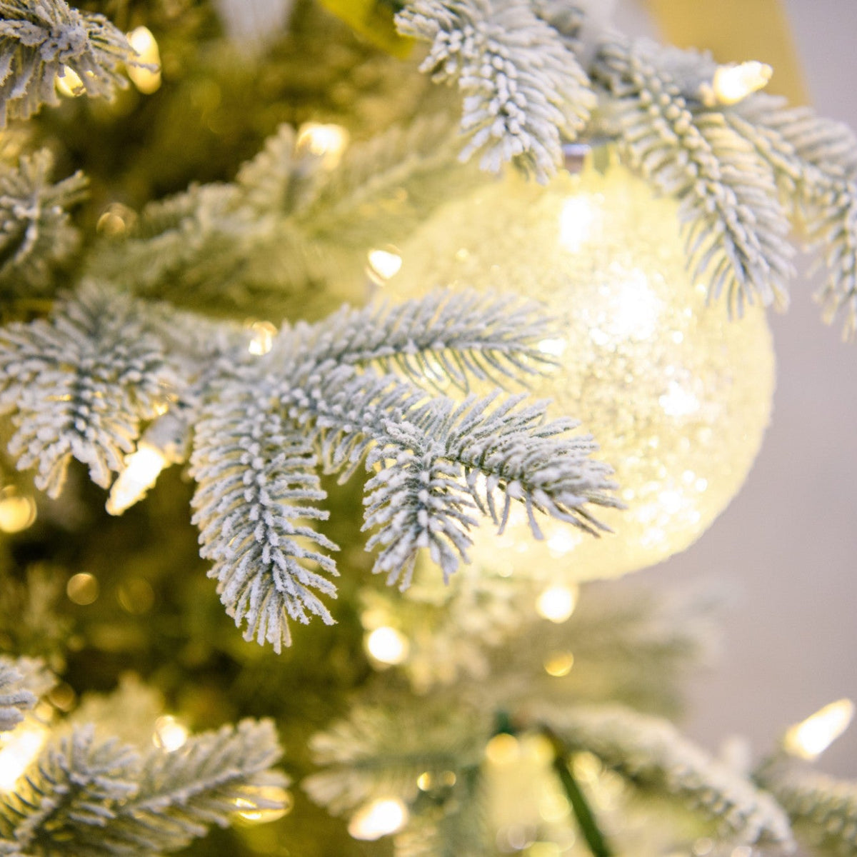 7.5' One Plug Flock Virginia Pine Tree with Icy Ball - flocked branches, ornaments and lights close-up 1