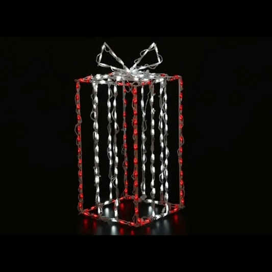 Tall 3D Gift Box LED Display in red and white with glowing white bow on top, wireframe LED construction against black background