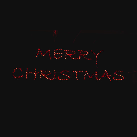 Merry Christmas Modern Script RGB LED sign animating through color changes, cursive lettering illuminated against a black background