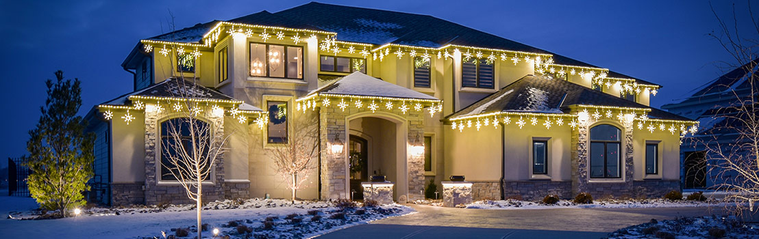 Icicle Lights on Two Story Home inBellevue, NE, Gretna, Omaha, Papillion, NE, and Valley, NE